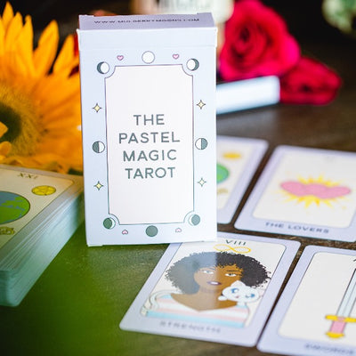 the pastel magic tarot next to tarot cards