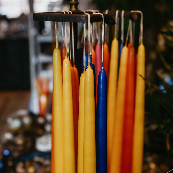 yellow, blue and orange taper candles hanging